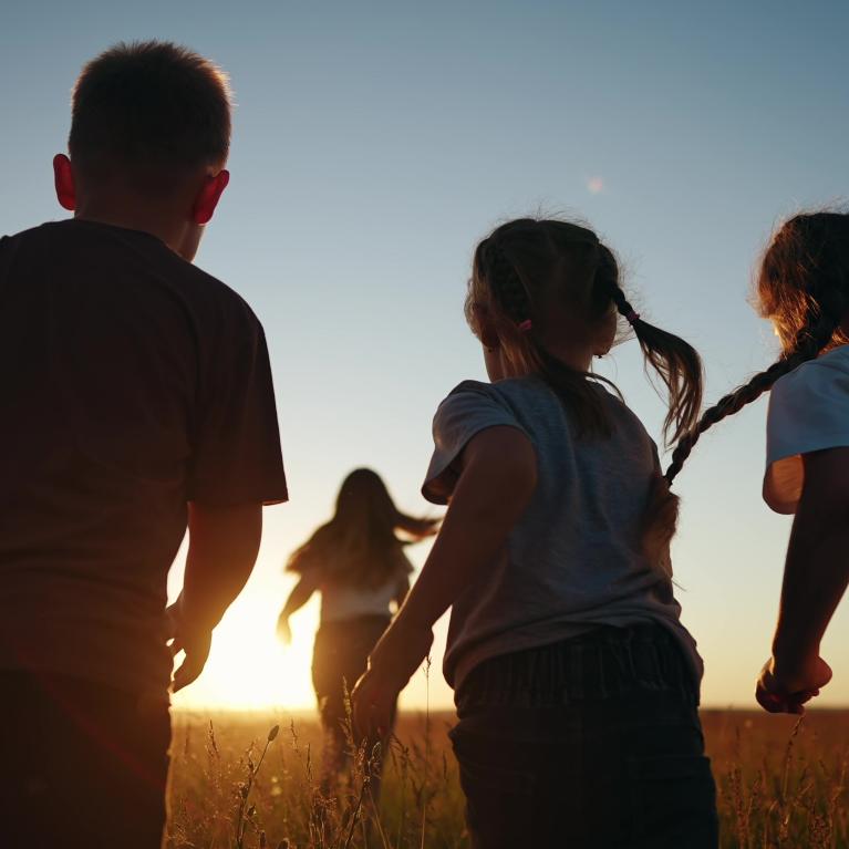 Children running in a field