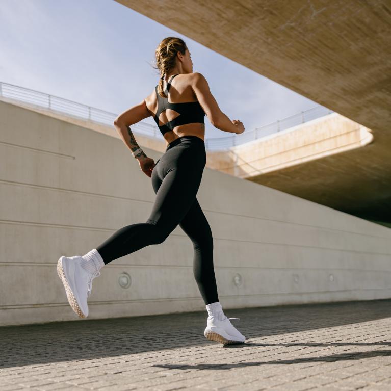 Woman running alone in a city 