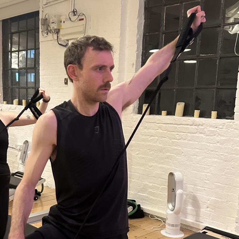 Freddie at a Reformer Pilates class