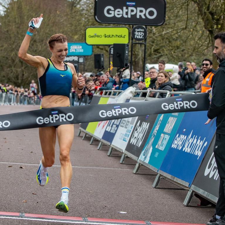 Alex Bell celebrates winning the 2026 GetPRO Bath Half