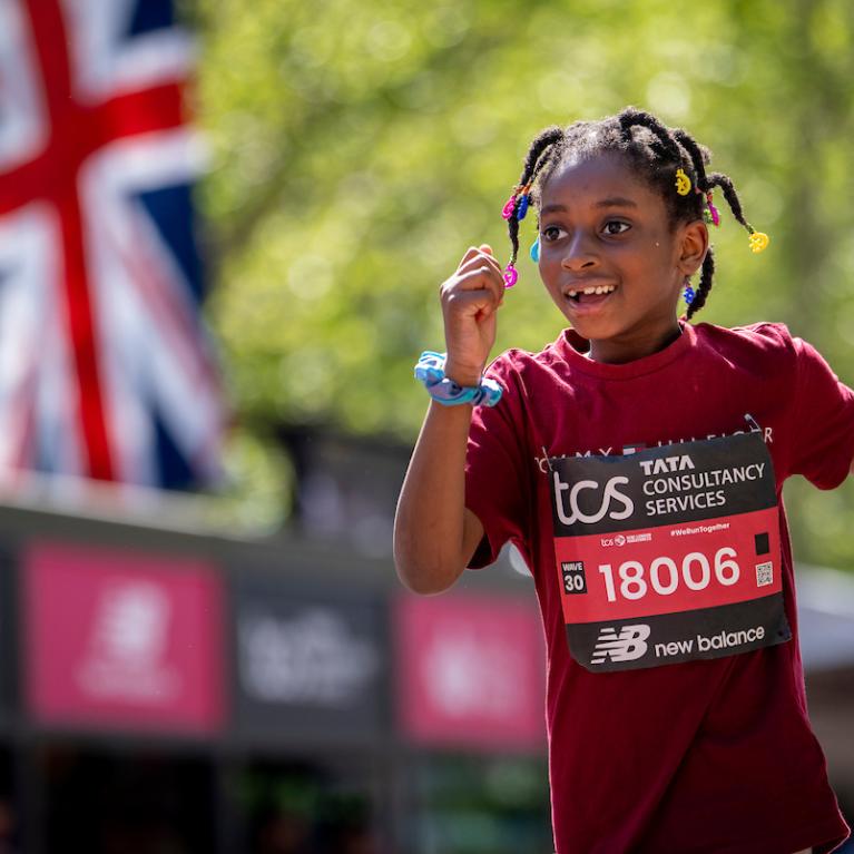 A TCS Mini London Marathon participant approaches the Finish Line on The Mall