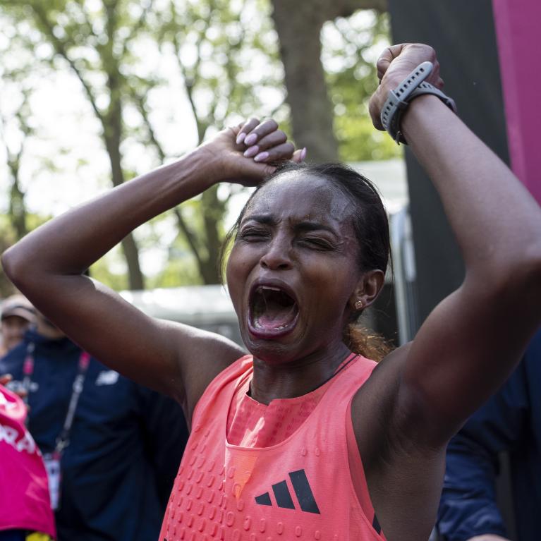Tigst Assefa screams with joy at the Finish Line