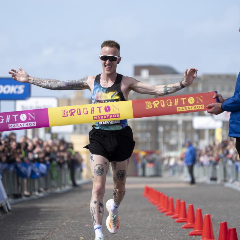 Sam Cook crossing the Finish Line