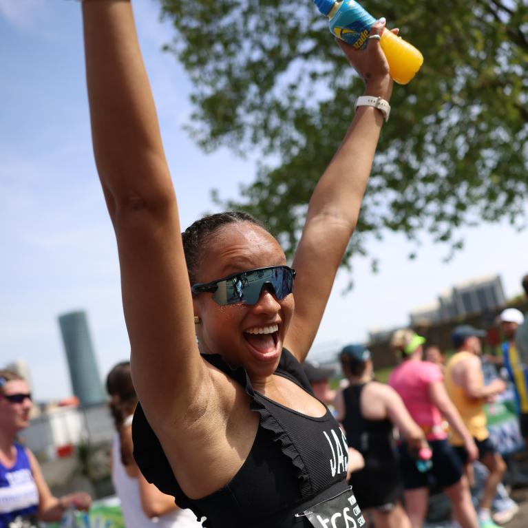 Runner celebrating on the TCS London Marathon course