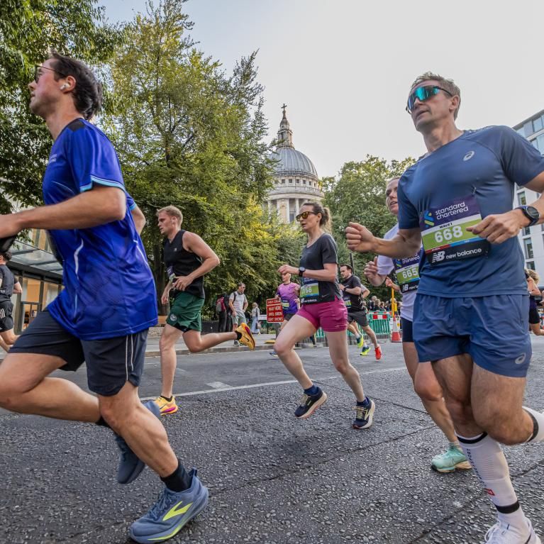Runners pass St Pauls on the City Race course 