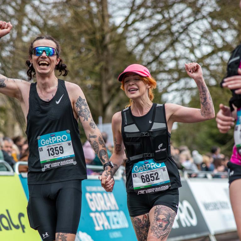 Bath Half participants almost at the Finish Line hand-in-hand