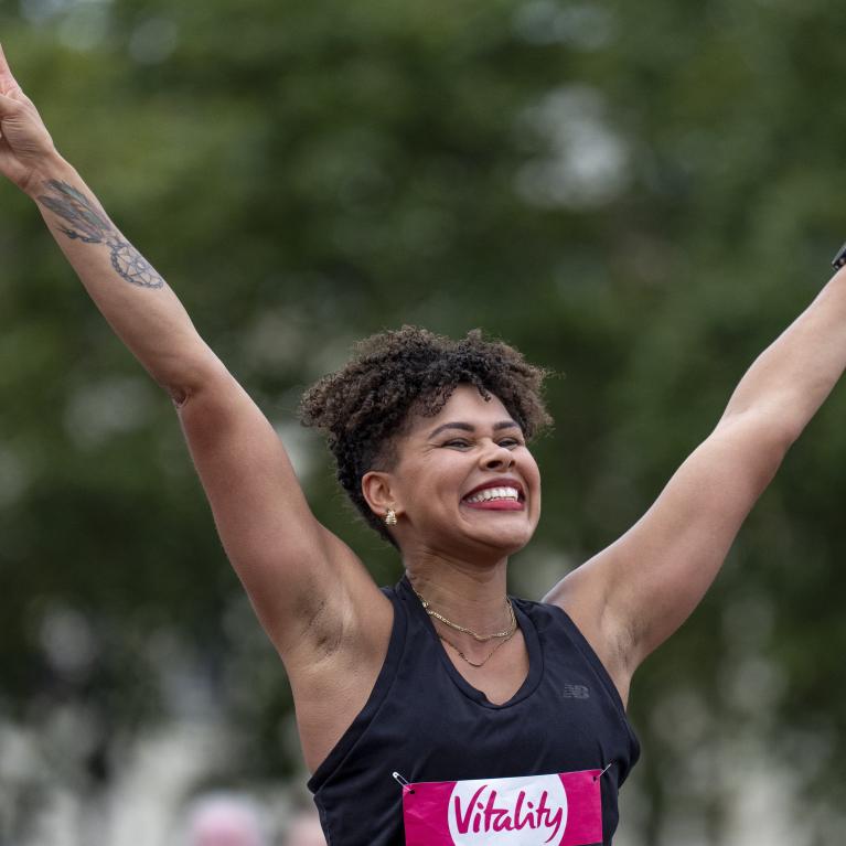 Runner celebrates as they had to the Finish Line
