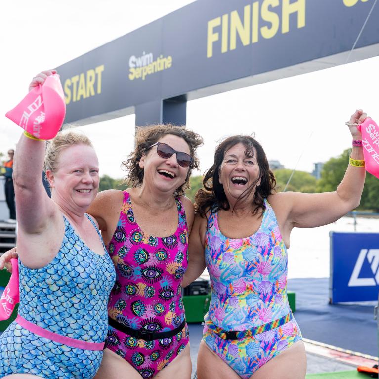Finishers celebrate completing 2026 Swim Serpentine