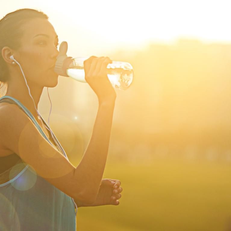 Runner hydrating 