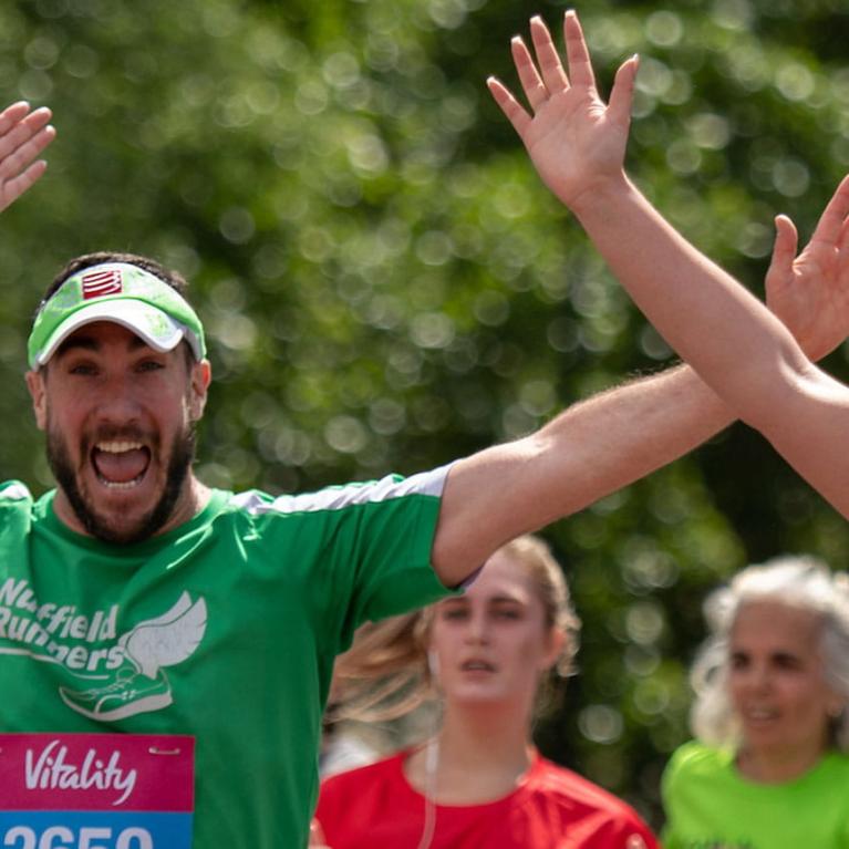 Runners approach the finish line at Buckingham Palace. The Vitality London 10,000, Monday 27
