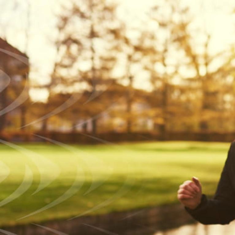 Two friends partner up for a training run in the park