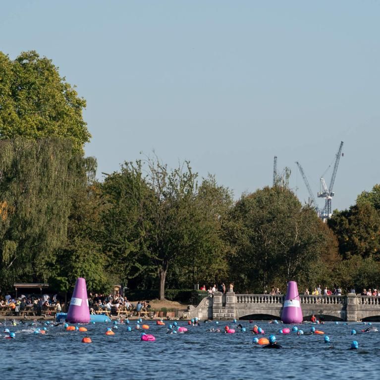 A group of swimmers in the Serpentine lake