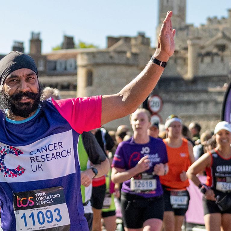 TCSLM 2022 charity runner with Tower of London in the background