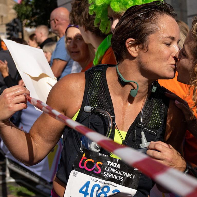 General scene of spectators and runners at the Rainbow Road section of The TCS London Marathon on Sunday 2nd October 2022