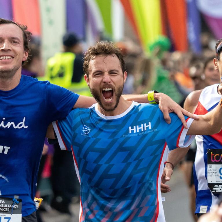 Runners cross Tower Bridge at the TCS London Marathon