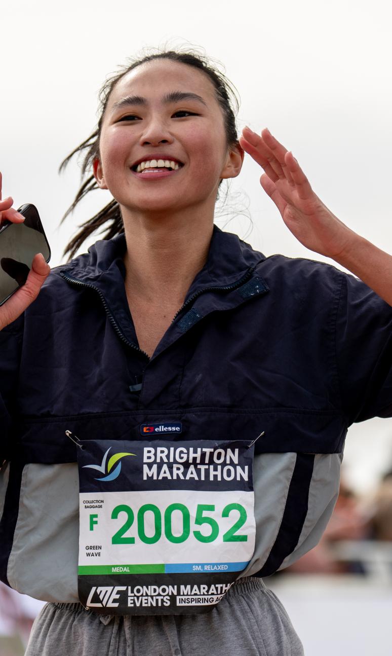 women running holding phone