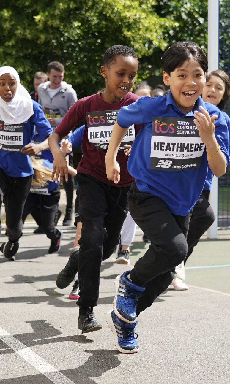 School children complete their mile in the playground
