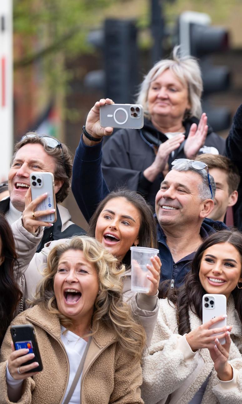 Friends and family watching their loved ones run