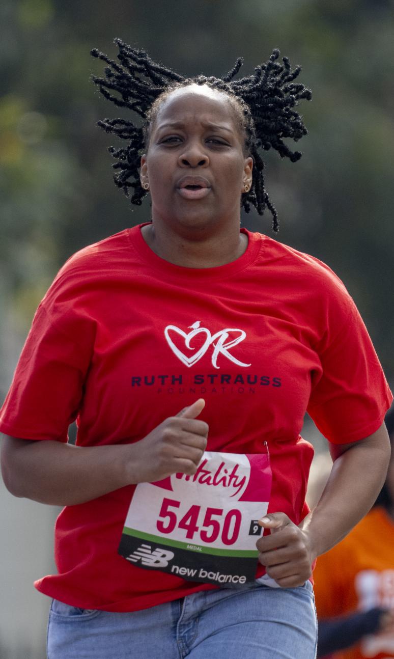 An adult running the Vitality Westminster Mile 