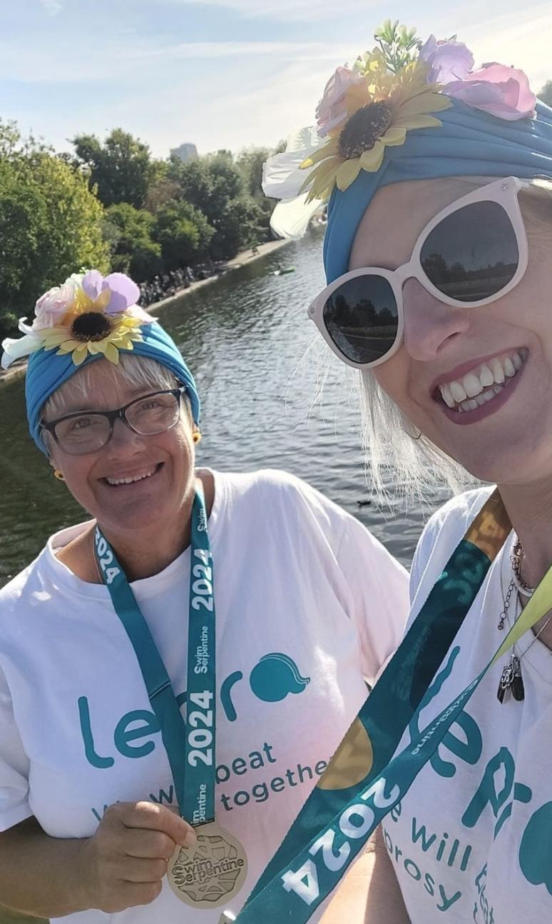 Deryn Martin and Sami Hope pose with their Swim Serpentine medals 