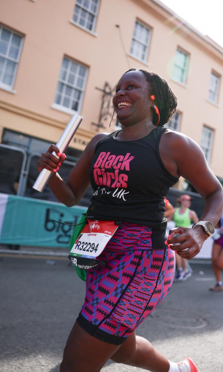 Big Relay participant carrying a baton 