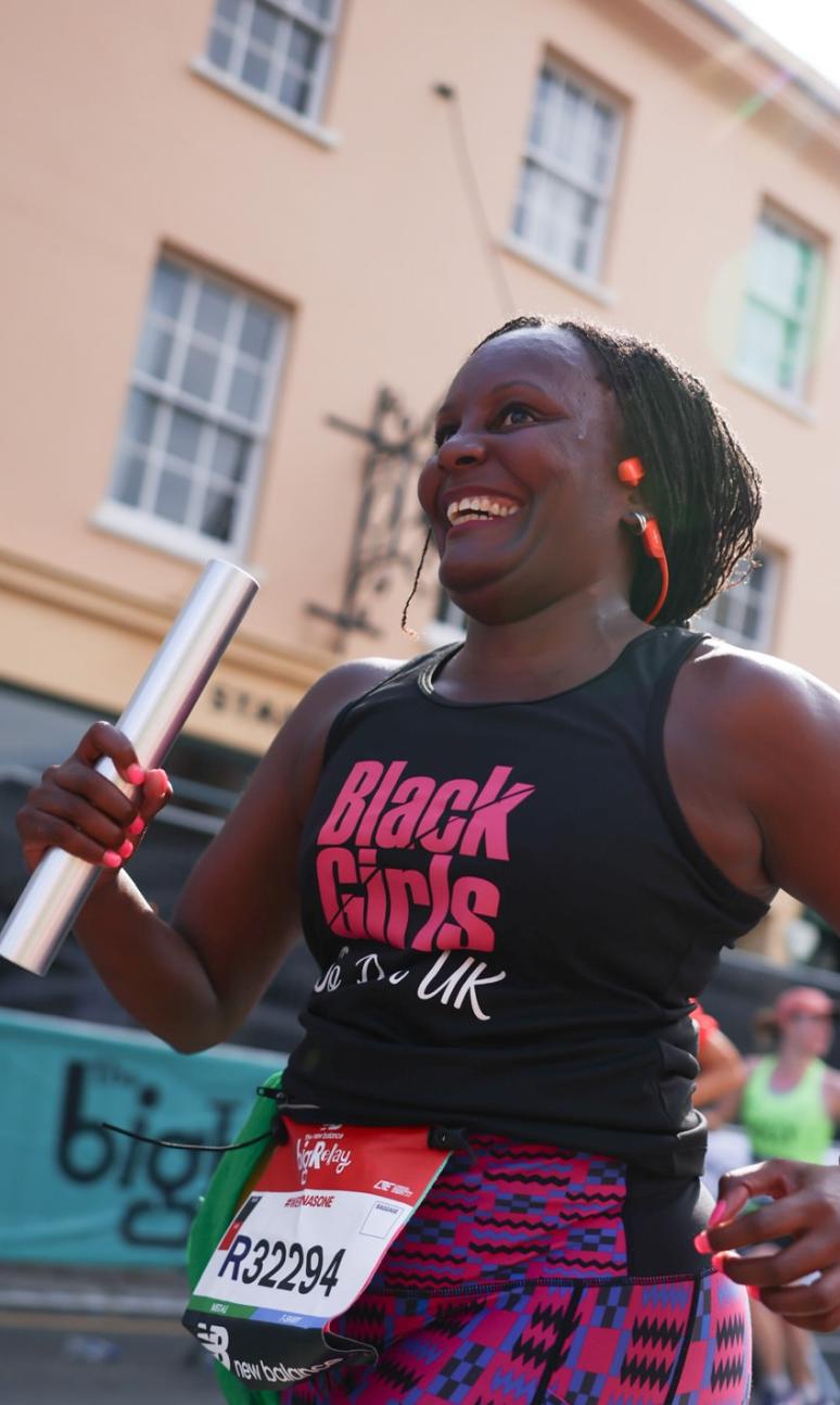 Relay participant carrying a baton 
