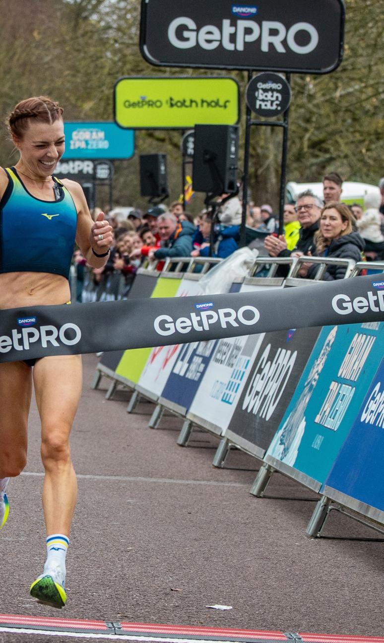 Alex Bell celebrates winning the 2026 GetPRO Bath Half