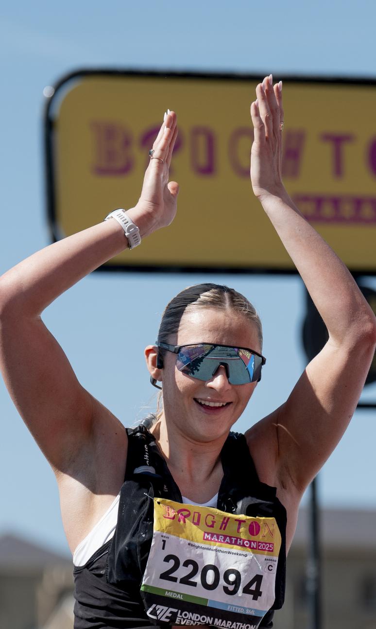 Brighton Marathon participant applauds the camera 