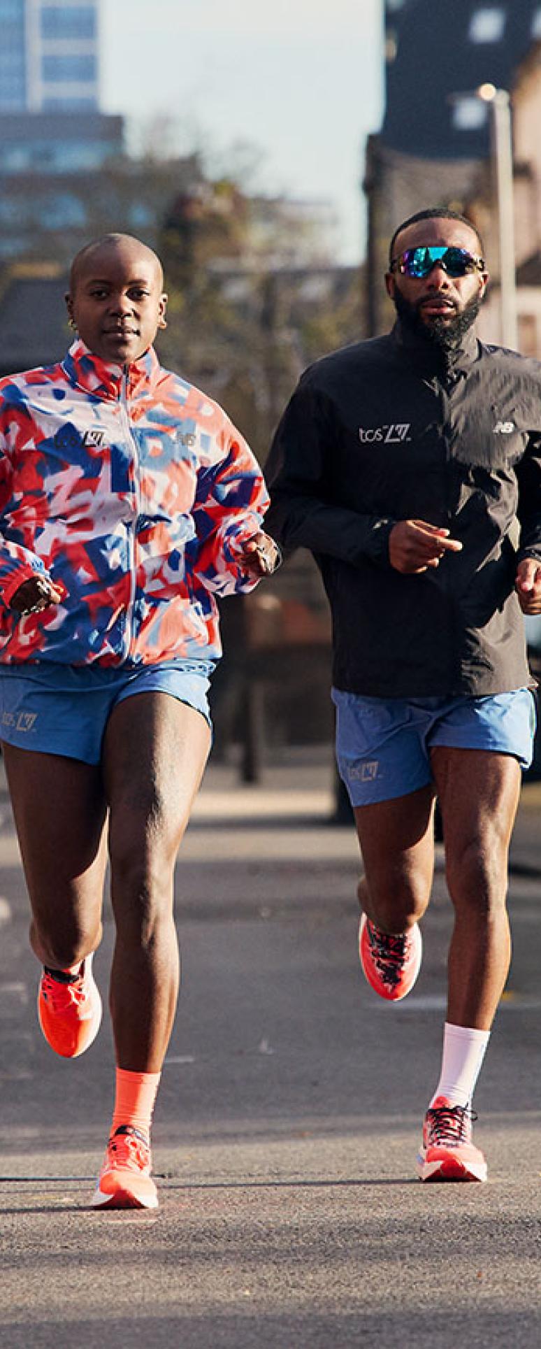 Two men running down the road during a training run 