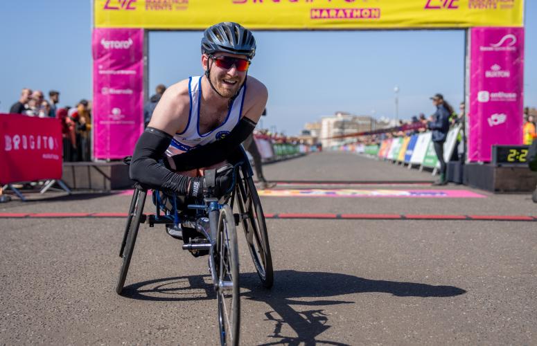 Marathon participant poses at the Finish Line