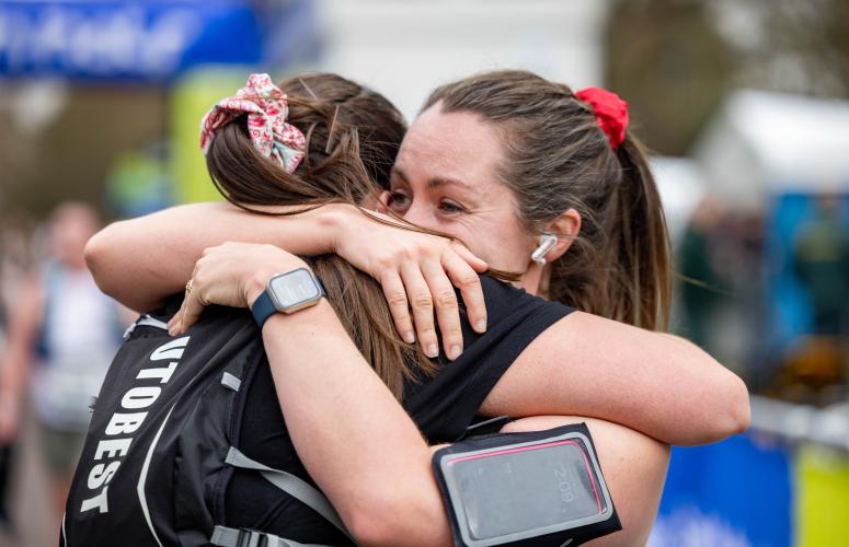 Participants hug each other