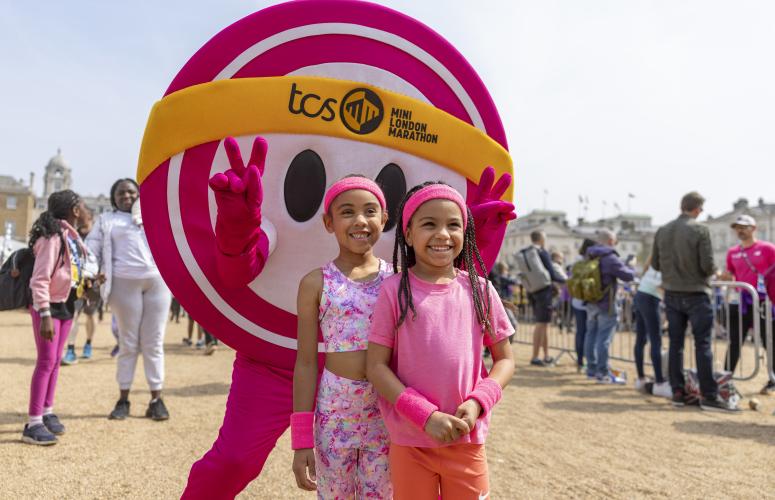 Children post with The Dot mascot 