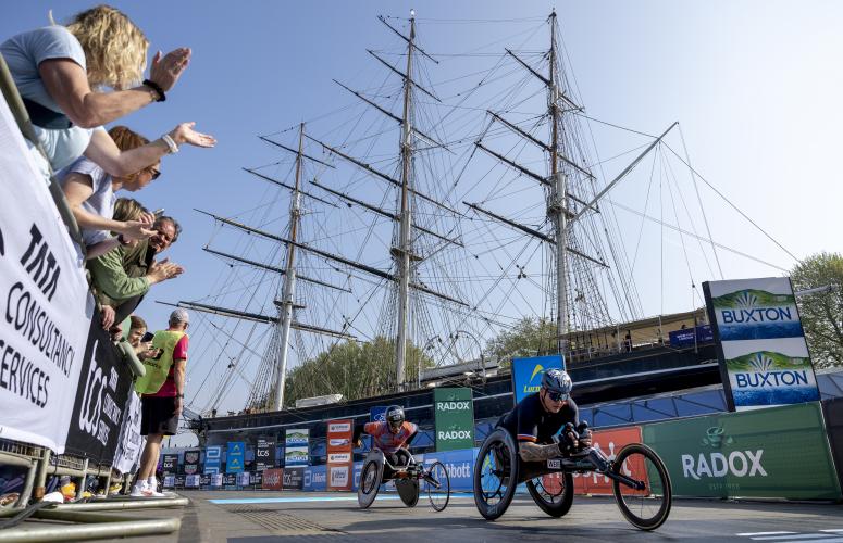 The Elite wheelchair men's race passes the Cutty Sark