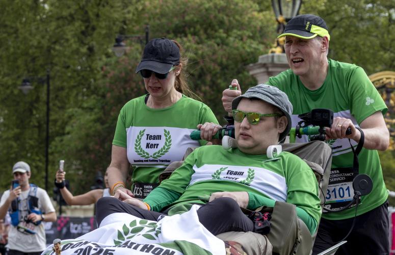 Assisted wheelchair group heading to the Finish Line