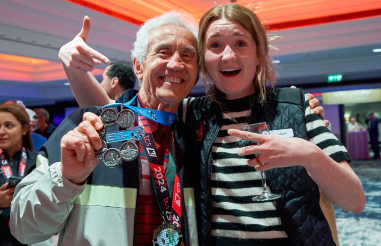 Celebrating a runner who has just got their six star medal
