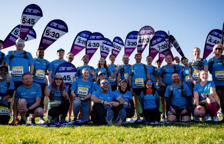 Pacers gather before the start of the marathon