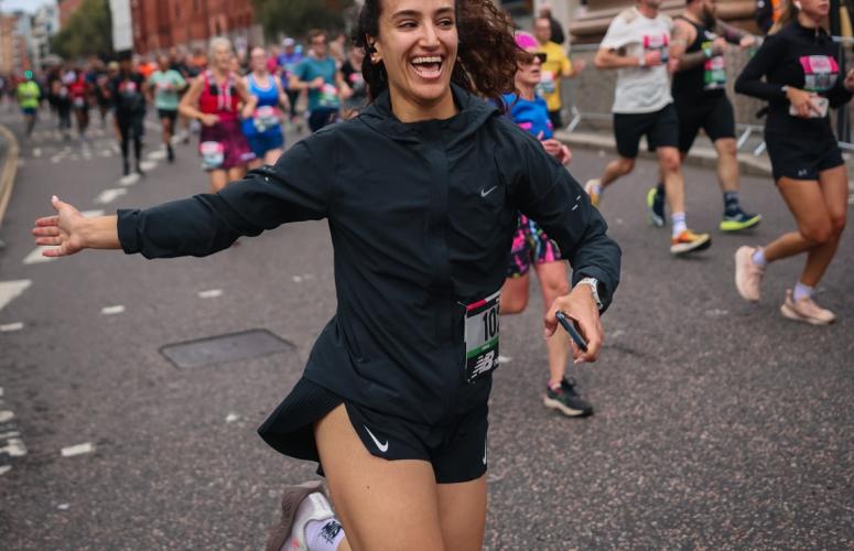 Runner high-fiving spectators 