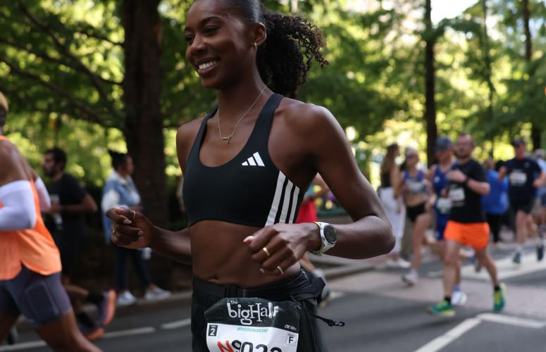 Runners pass by a park