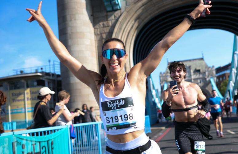 Runner crosses Tower Bridge