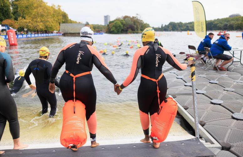 Swimmers getting into the water 