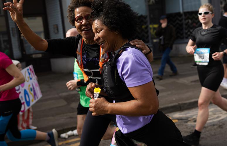 Woman gives a peace sign to the camera