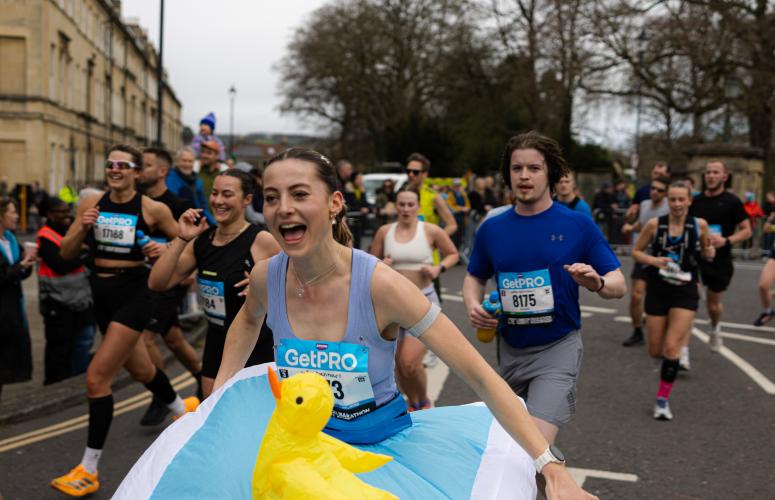 Runner with an inflatable bath attached to them 