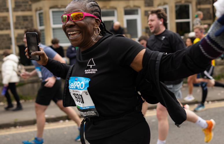 Runner looking overjoyed on the course