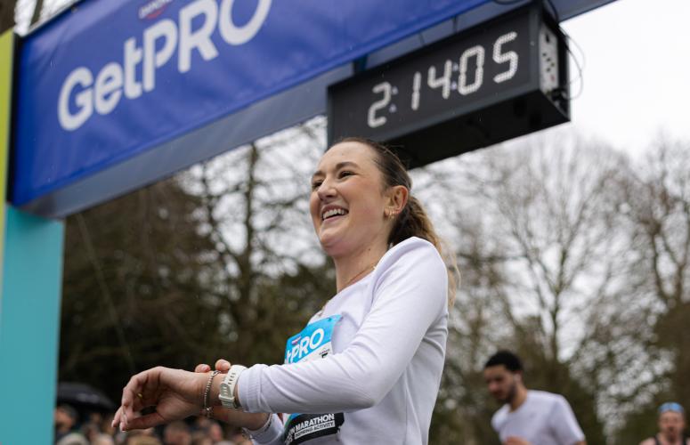 Bath Half participant crosses the Finish Line