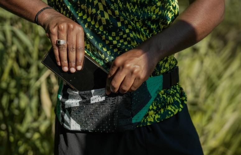 Runner showing off on of the Big Half running belts