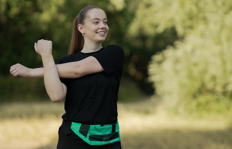 Runner showing off on of the Big Half running belts 