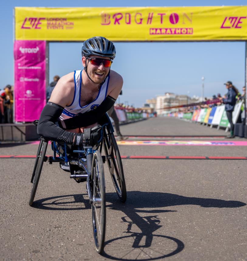 Marathon participant poses at the Finish Line