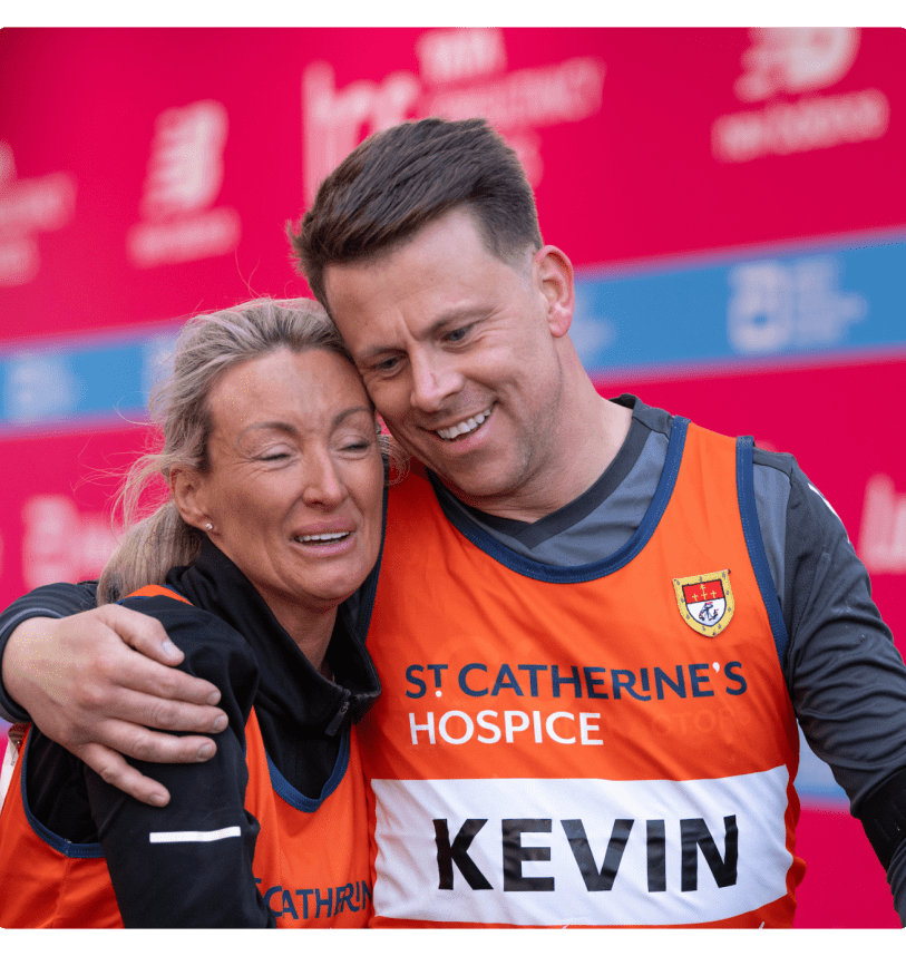 Two participants embrace on the Finish Line after their TCS London Marathon