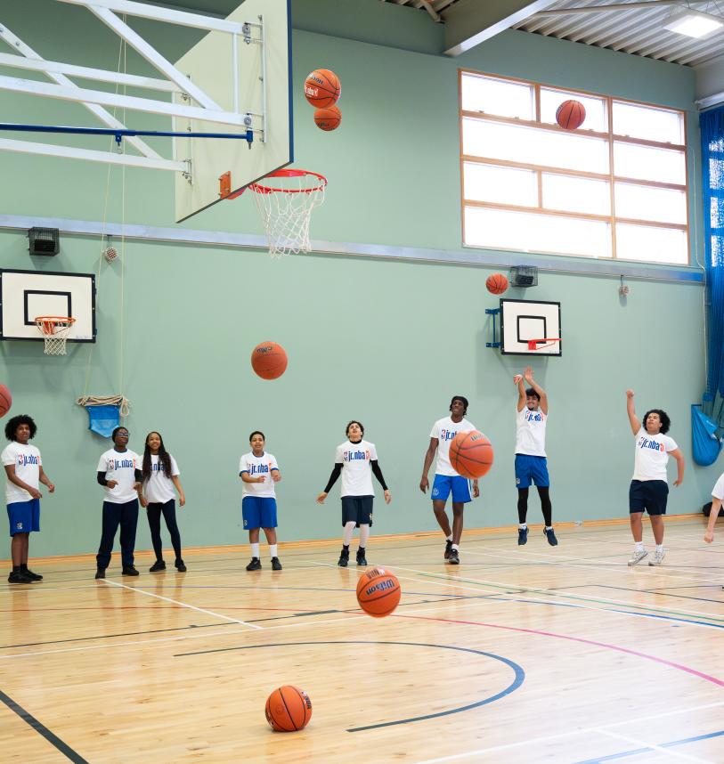 Young people shooting hoops for the Jr. NBA 3v3 launch 
