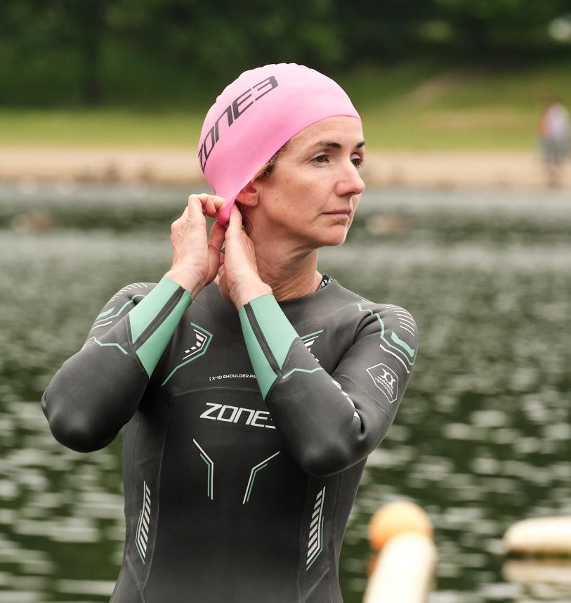 Sam Haddad adjusting her swim cap at the Serpentine Lido
